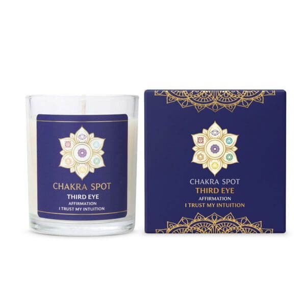 Chakra spot candle with decorative packaging.