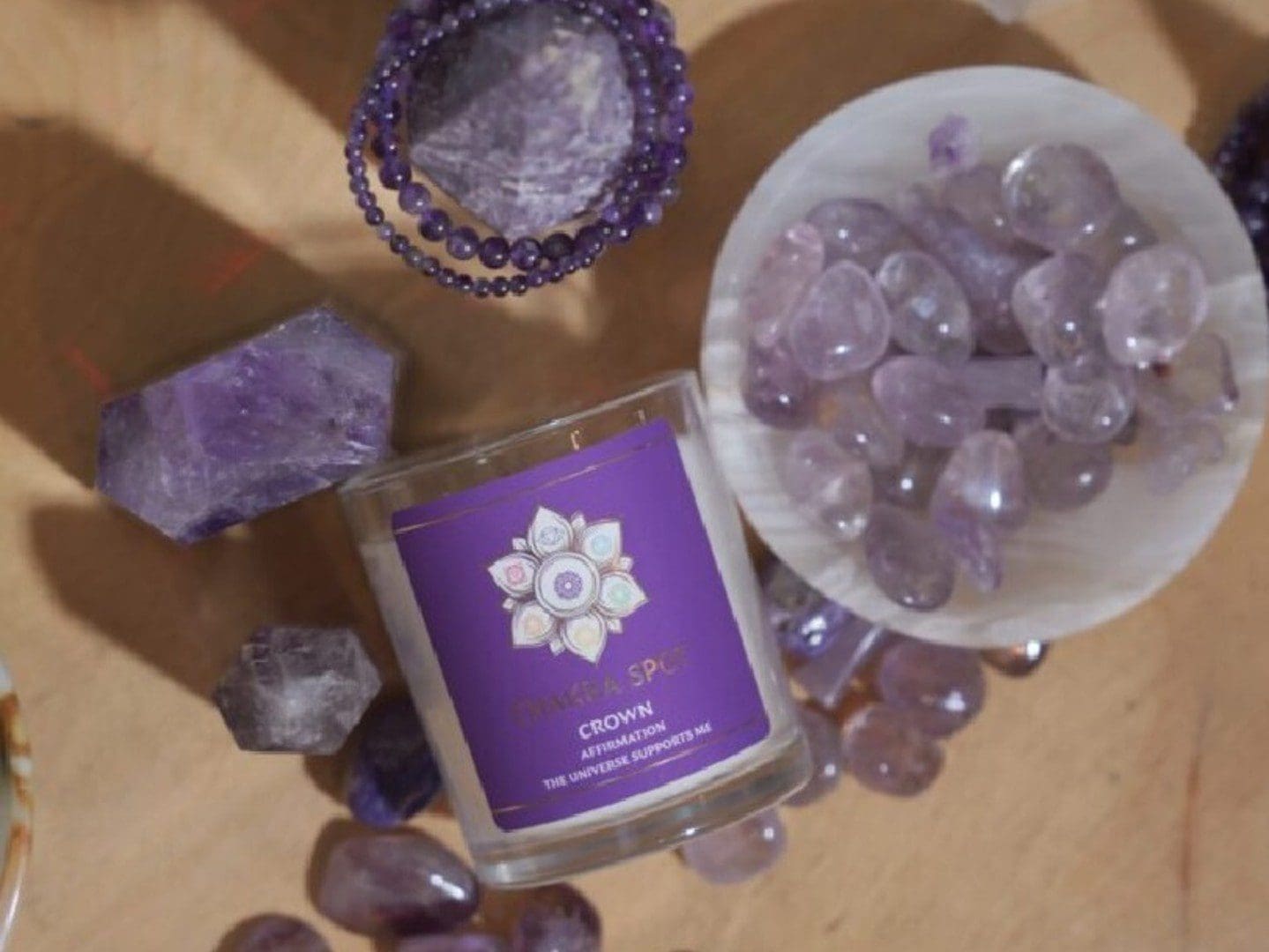 Candle with amethyst stones and bracelet.
